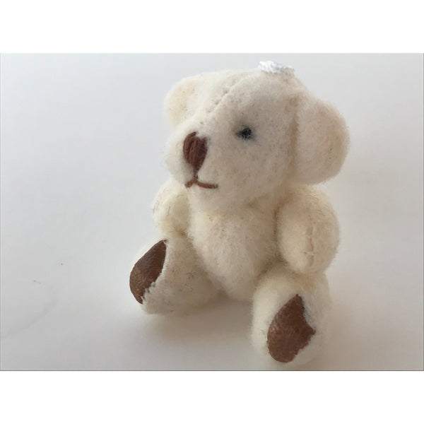 stuffed small stuffed bear white